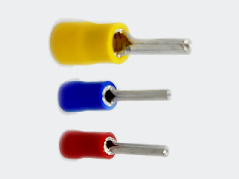 Terminales aislados tipo pin en amarillo, azul y rojo